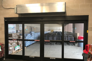 An automatic door in a grocery store with an air curtain